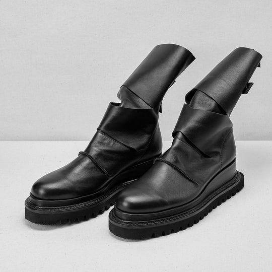 Smooth black leather cut-out booties