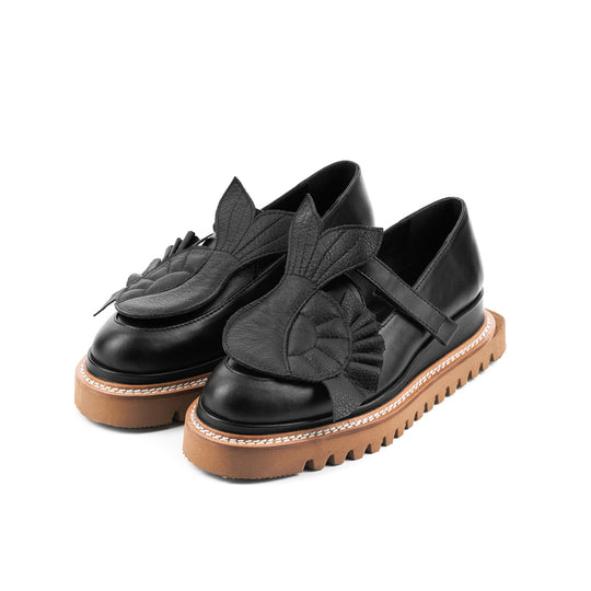 The Answer Within black leather loafers