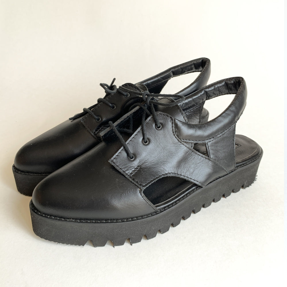 Sustainable Selection - Black leather cut-out shoes