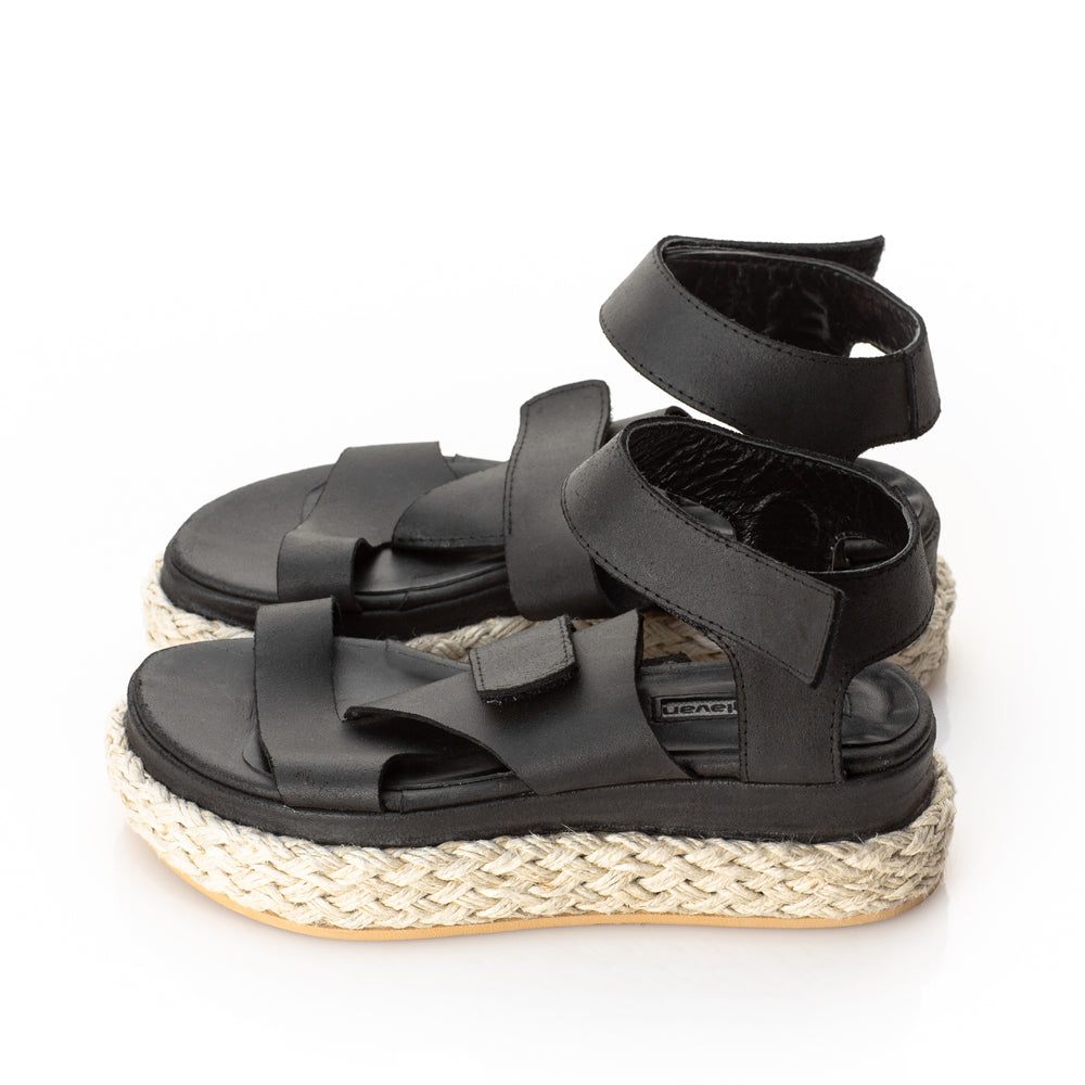 Folded black leather sandals