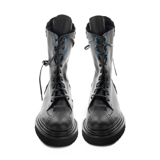 Handcrafted leather boots with black geometric sole