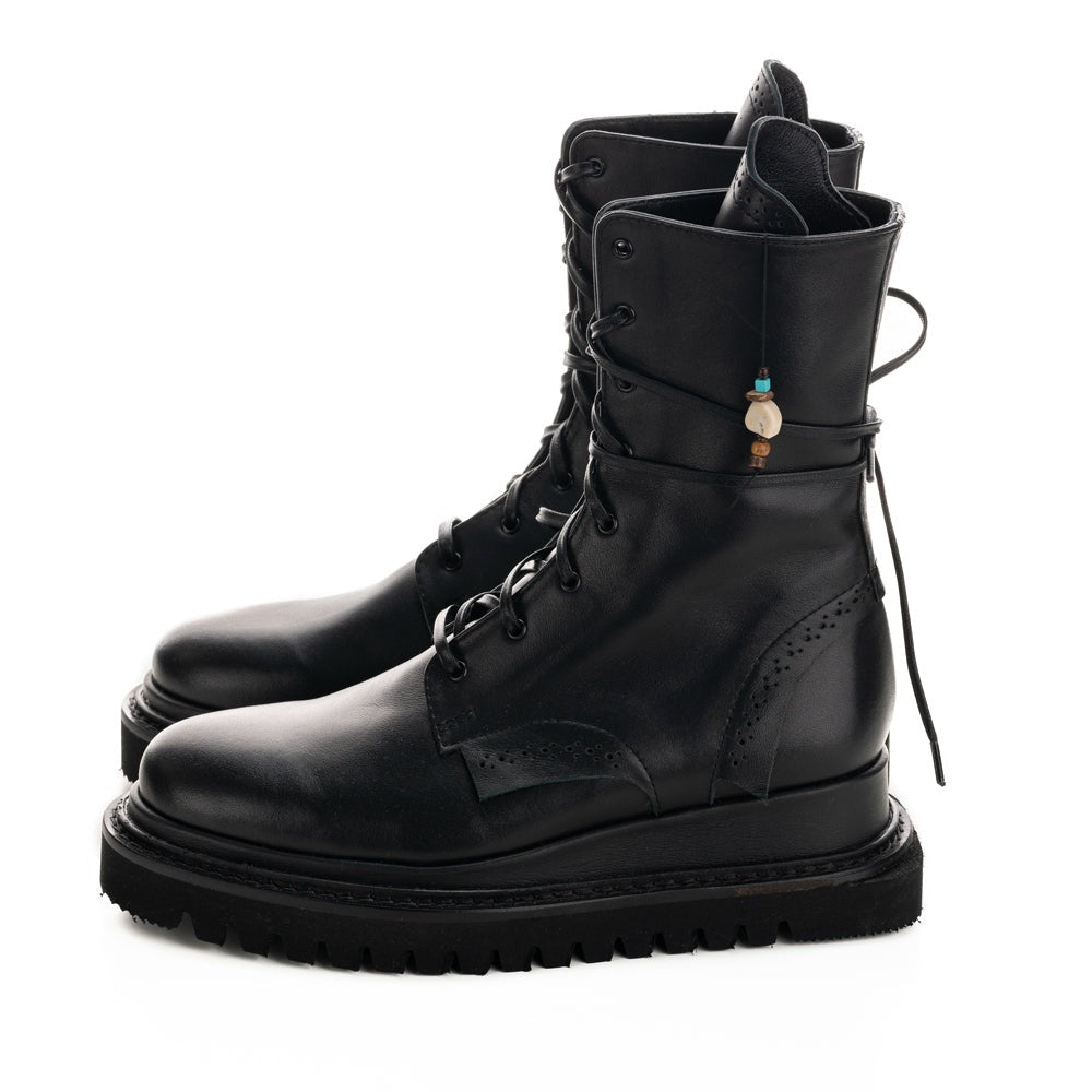 Black leather flat platform with black geometric sole