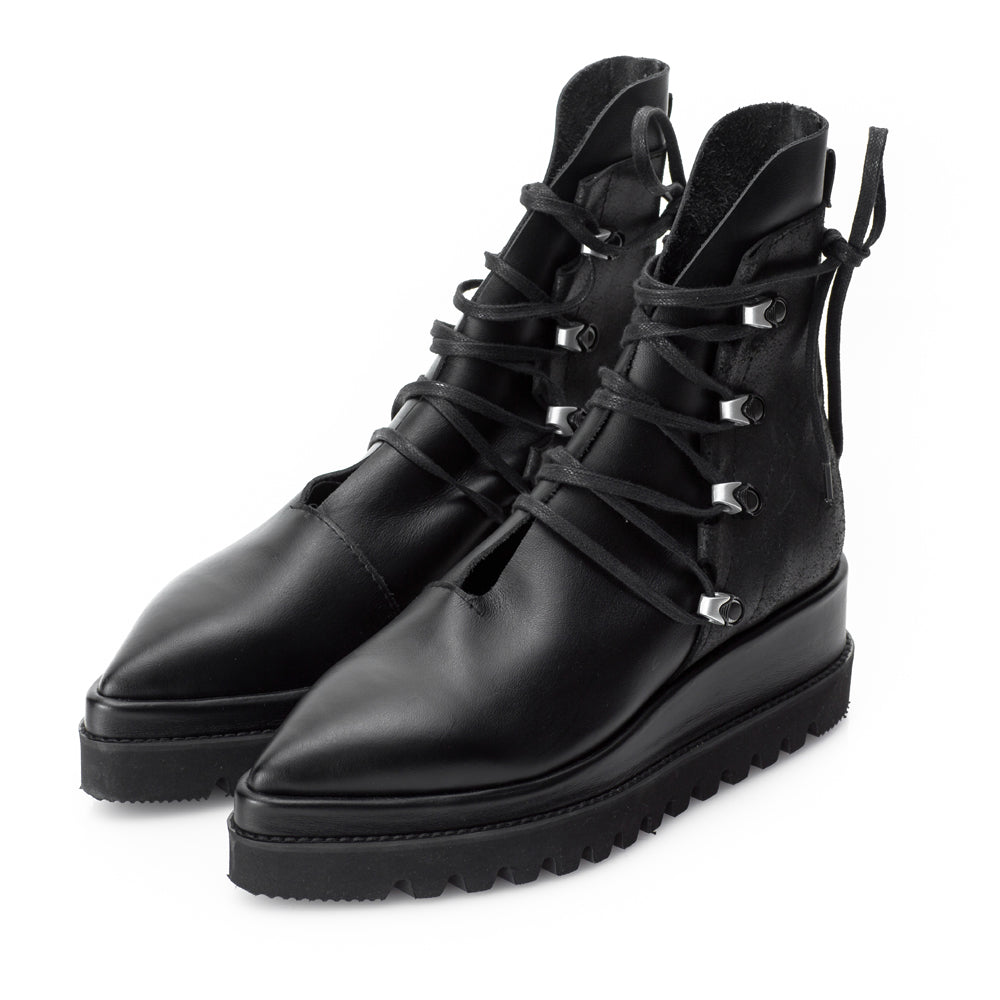 Black leather flat platform boots with nickel accessories