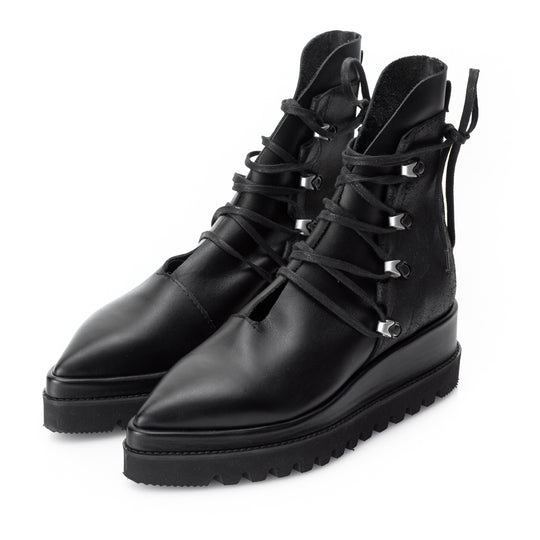 Black leather flat platform boots with nickel accessories