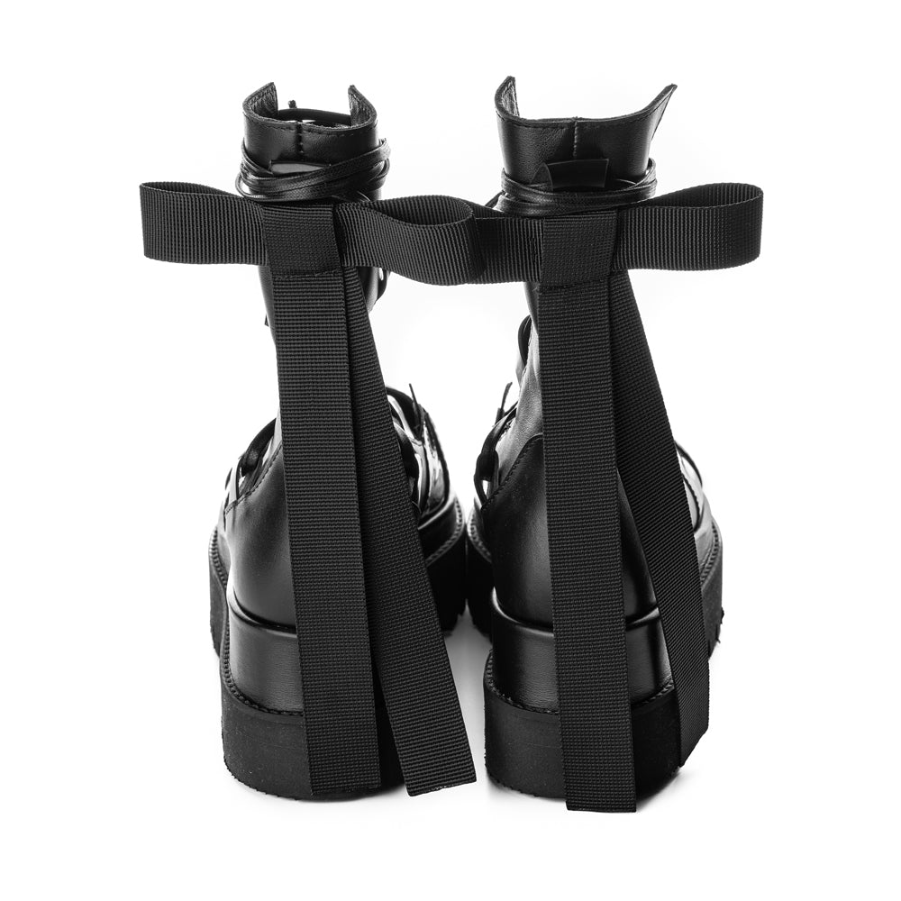 Designer flat platform boots with delicate ribbed bow decoration