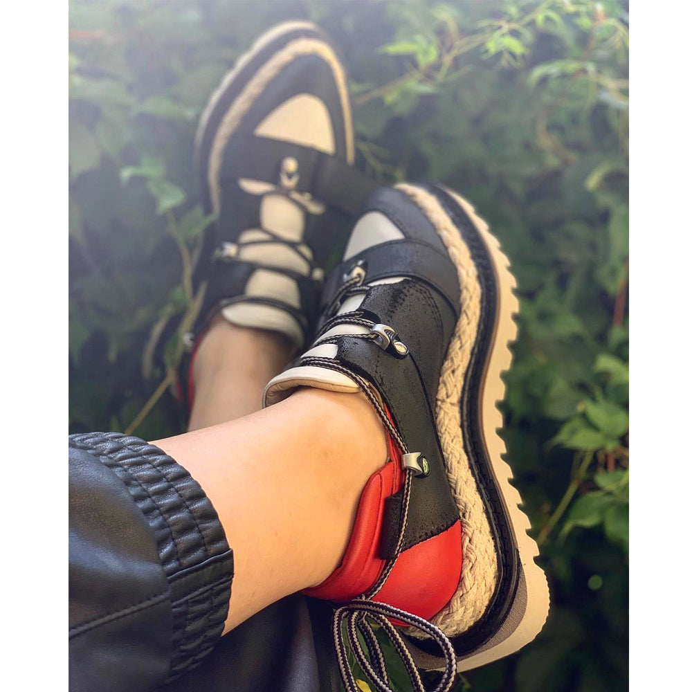 Black leather shoes with white leather detail, red leather back detail and jute covered flat platform