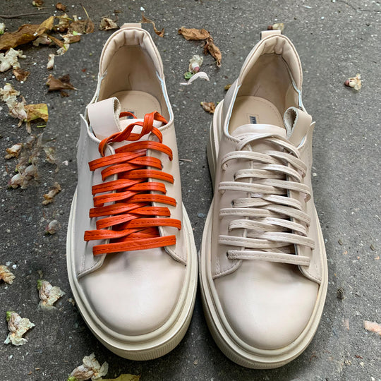 Sustainable Selection- light beige leather sneakers with orange details