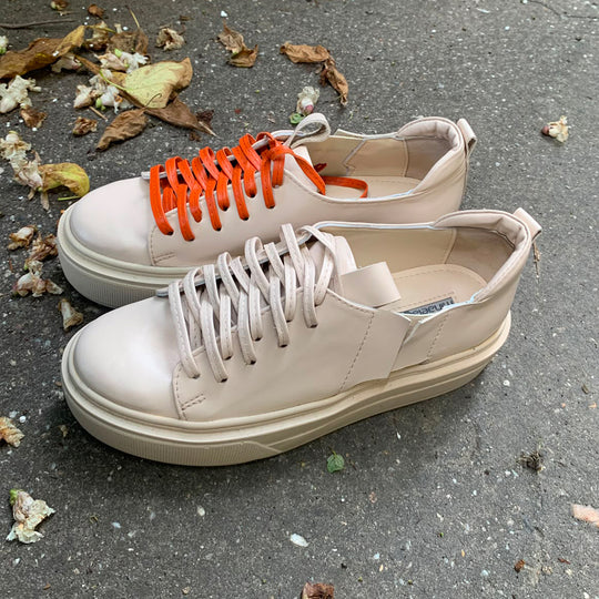 Sustainable Selection- light beige leather sneakers with orange details