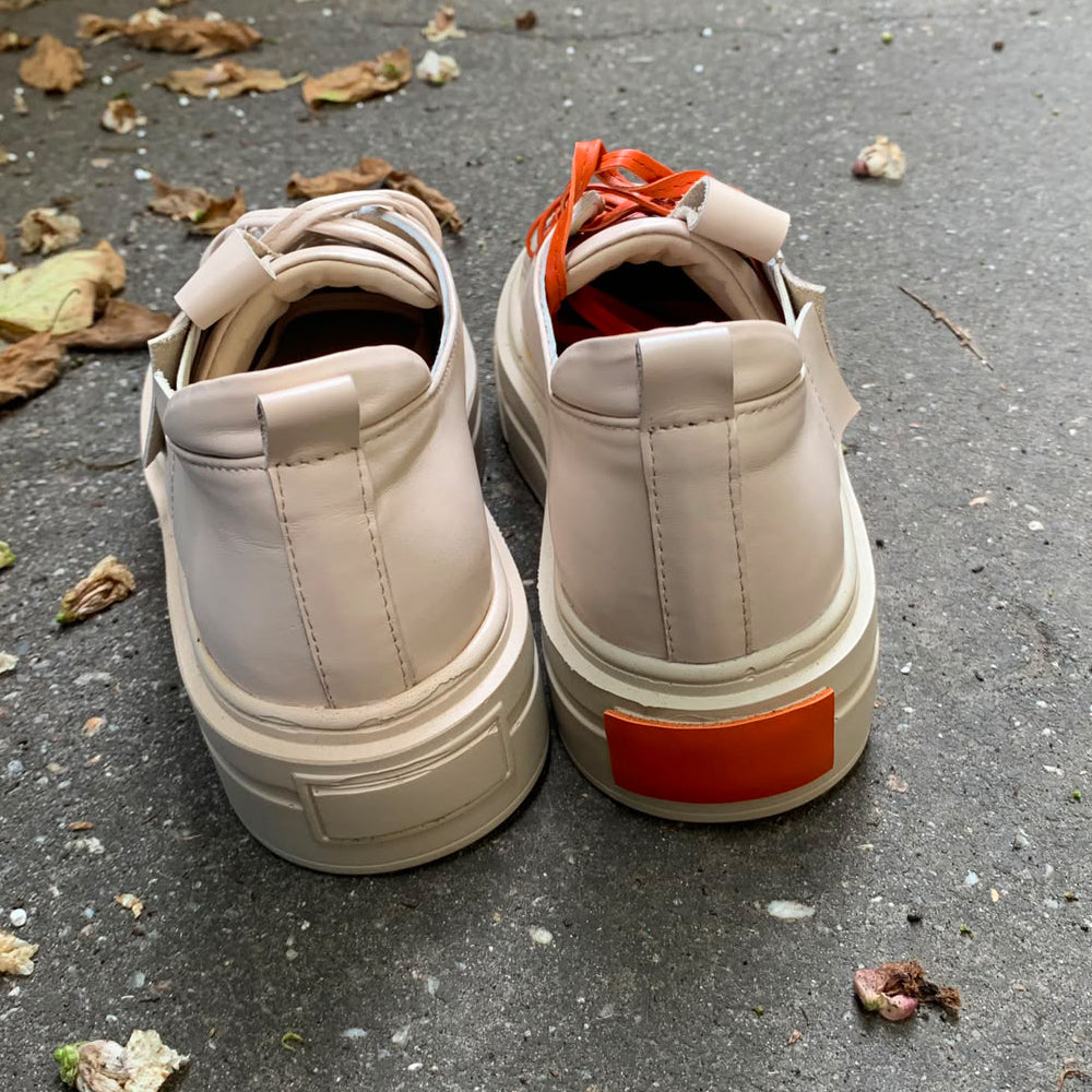 Sustainable Selection- light beige leather sneakers with orange details