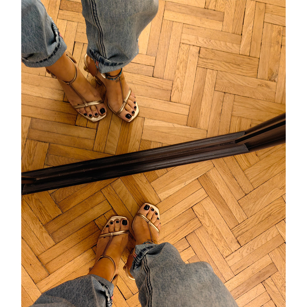 In your Arms golden leather sandals