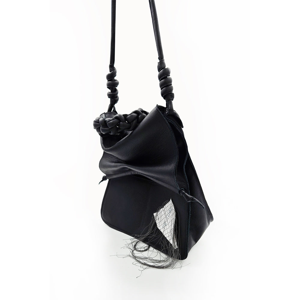 Paper Thoughts black leather bag
