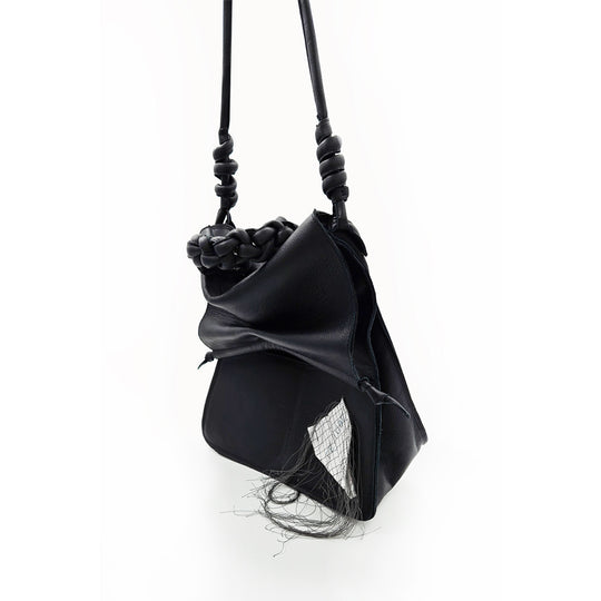 Paper Thoughts black leather bag