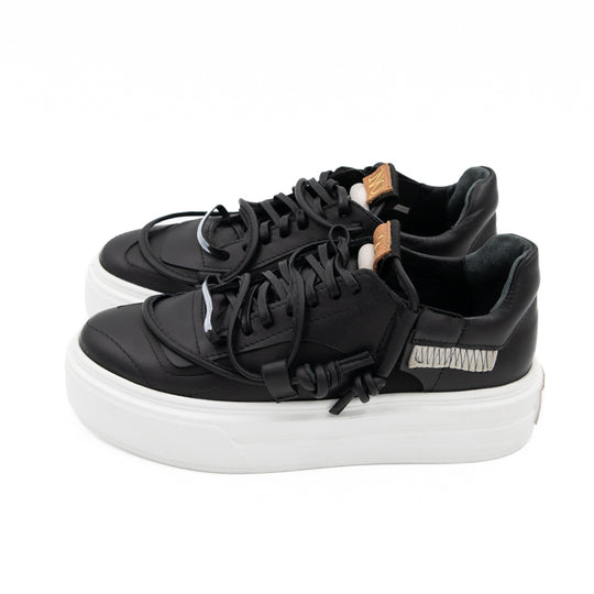 Remake of Us black leather low - top sneakers