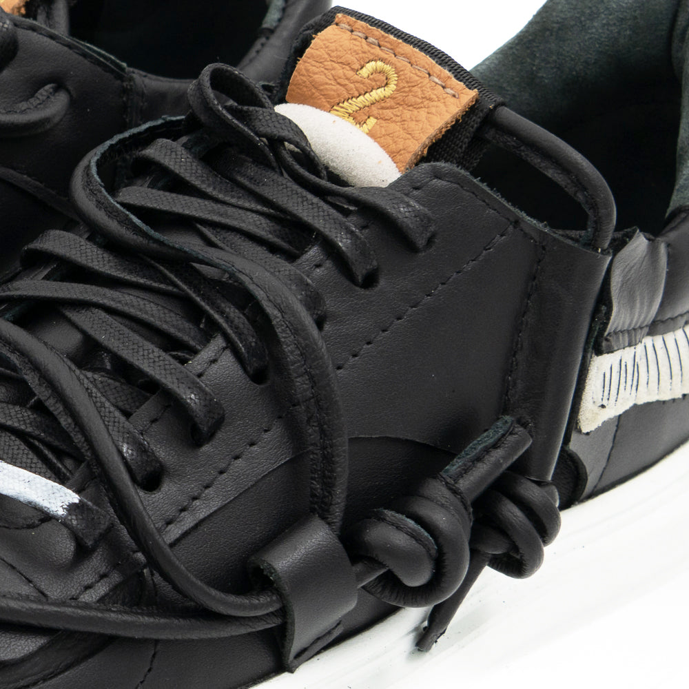 Remake of Us black leather low - top sneakers