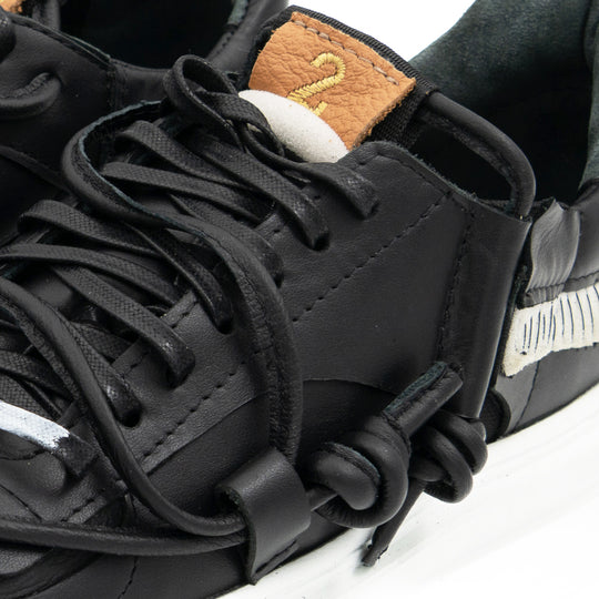 Remake of Us black leather low - top sneakers