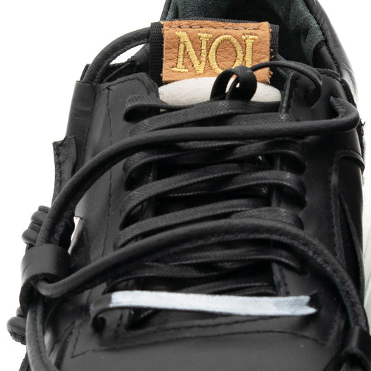 Remake of Us black leather low - top sneakers
