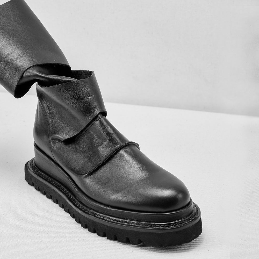 Smooth black leather cut-out booties