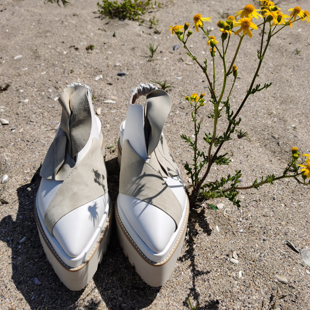 White leather covered flat platform, beige sole