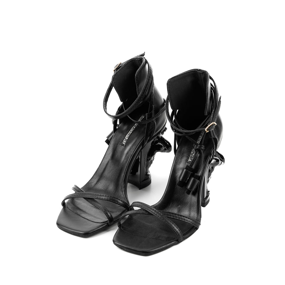 X-quisite black leather sandals