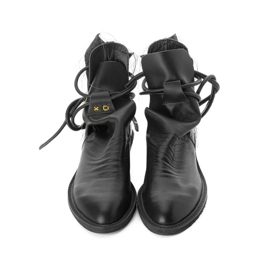 XOXO Paper Game black leather cut-out booties