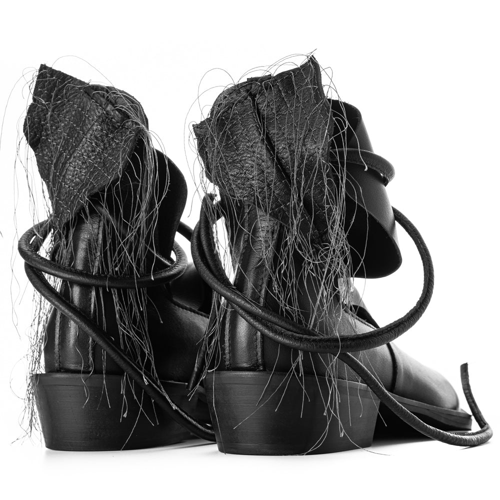 XOXO Paper Game black leather cut-out booties