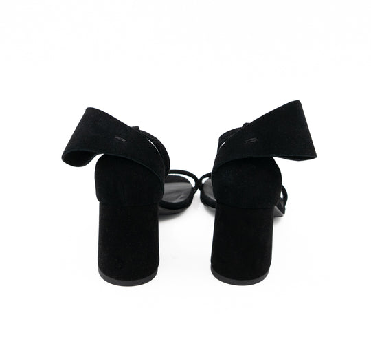 Rear view of Back to Bow black suede sandals, showing the bows above the suede-covered block heels.