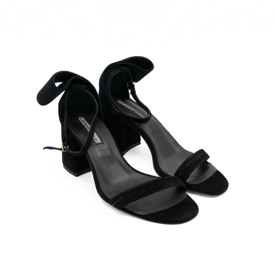 Back to Bow black suede sandals, opposite three-quarter view showing the open toes and gold-tone buckles.