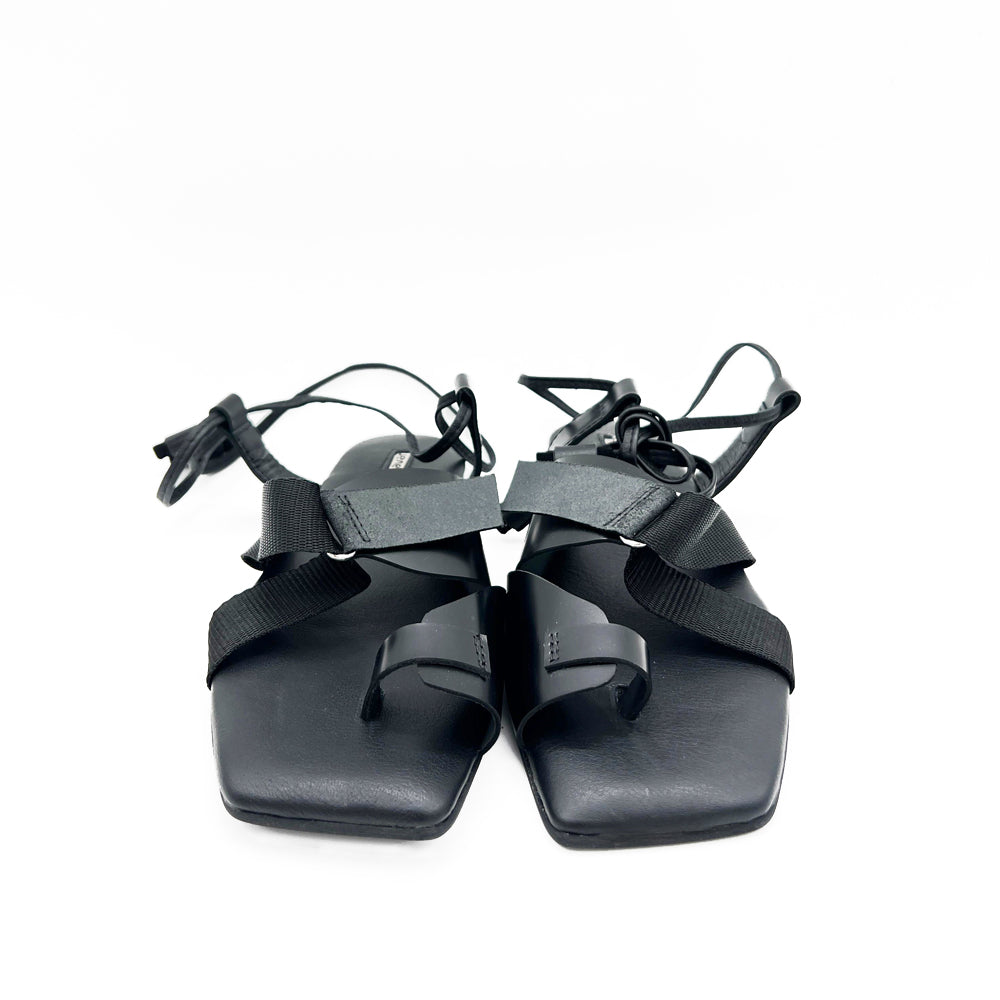 Cover Me In Sunrise black leather sandals