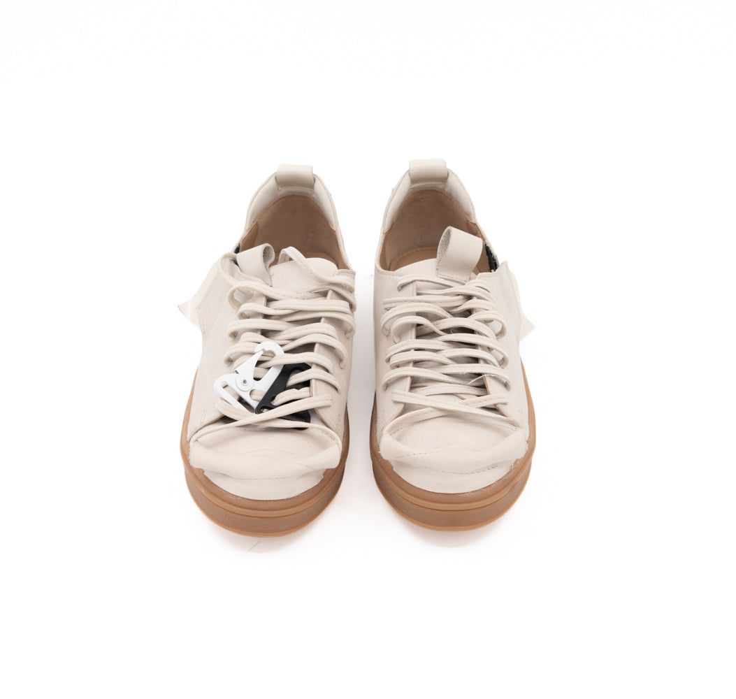 Front view of Crossroads light beige nubuck sneakers, showing the matching laces and metallic accessories.