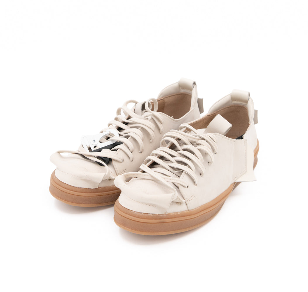 Crossroads light beige nubuck sneakers by Mihaela Glavan, three-quarter front view with beige soles and lace-up detailing.
