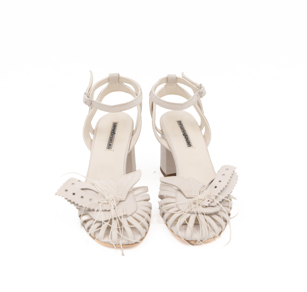 Dandy Lover light beige nubuck sandals by Mihaela Glavan, front view showing the quilted details and cage silhouette.