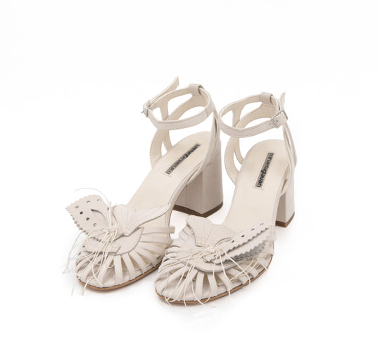 Dandy Lover light beige nubuck sandals by Mihaela Glavan, three-quarter view showing the quilted fishtail details and block heels.