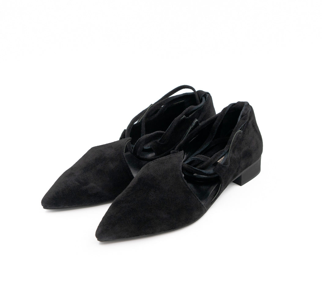 Desert Night black suede ballerinas by Mihaela Glavan, three-quarter view showing the pointed toes and wavy cut-outs.