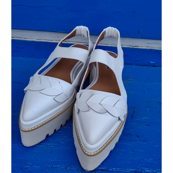 White leather covered flat platform and beige sole shoes