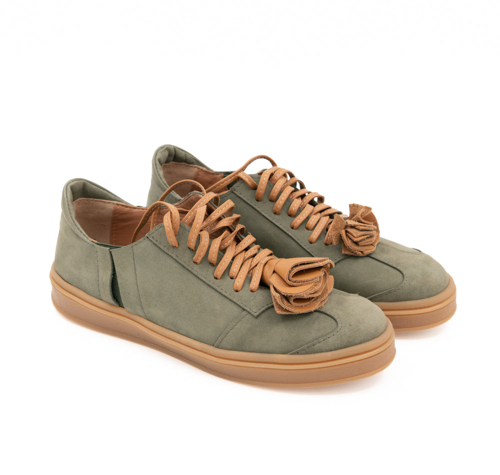 Make This Flower Great Again light khaki nubuck sneakers with tan flower details and soles, side-angle view.