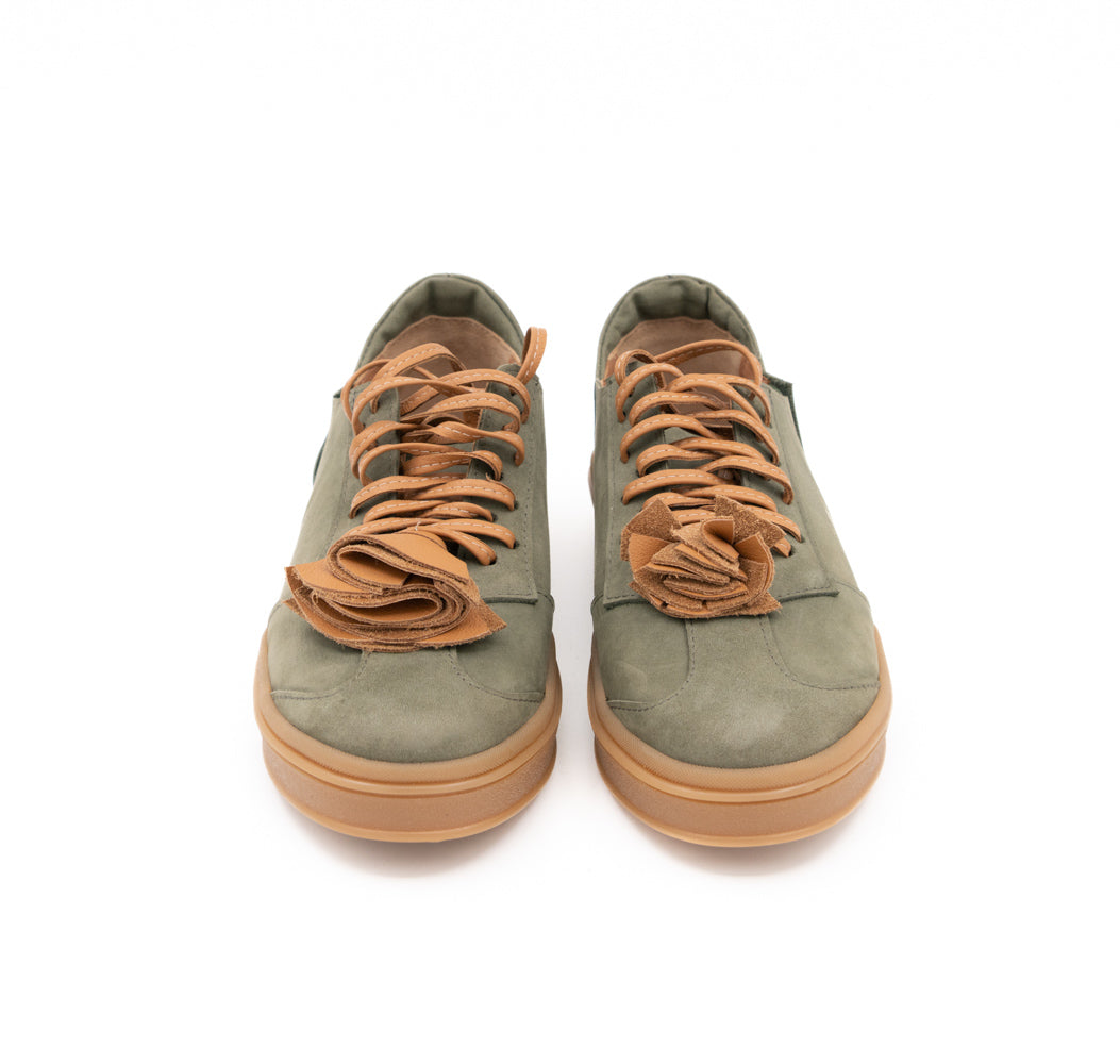 Make This Flower Great Again khaki nubuck sneakers showing tan laces and layered flower details, front view.