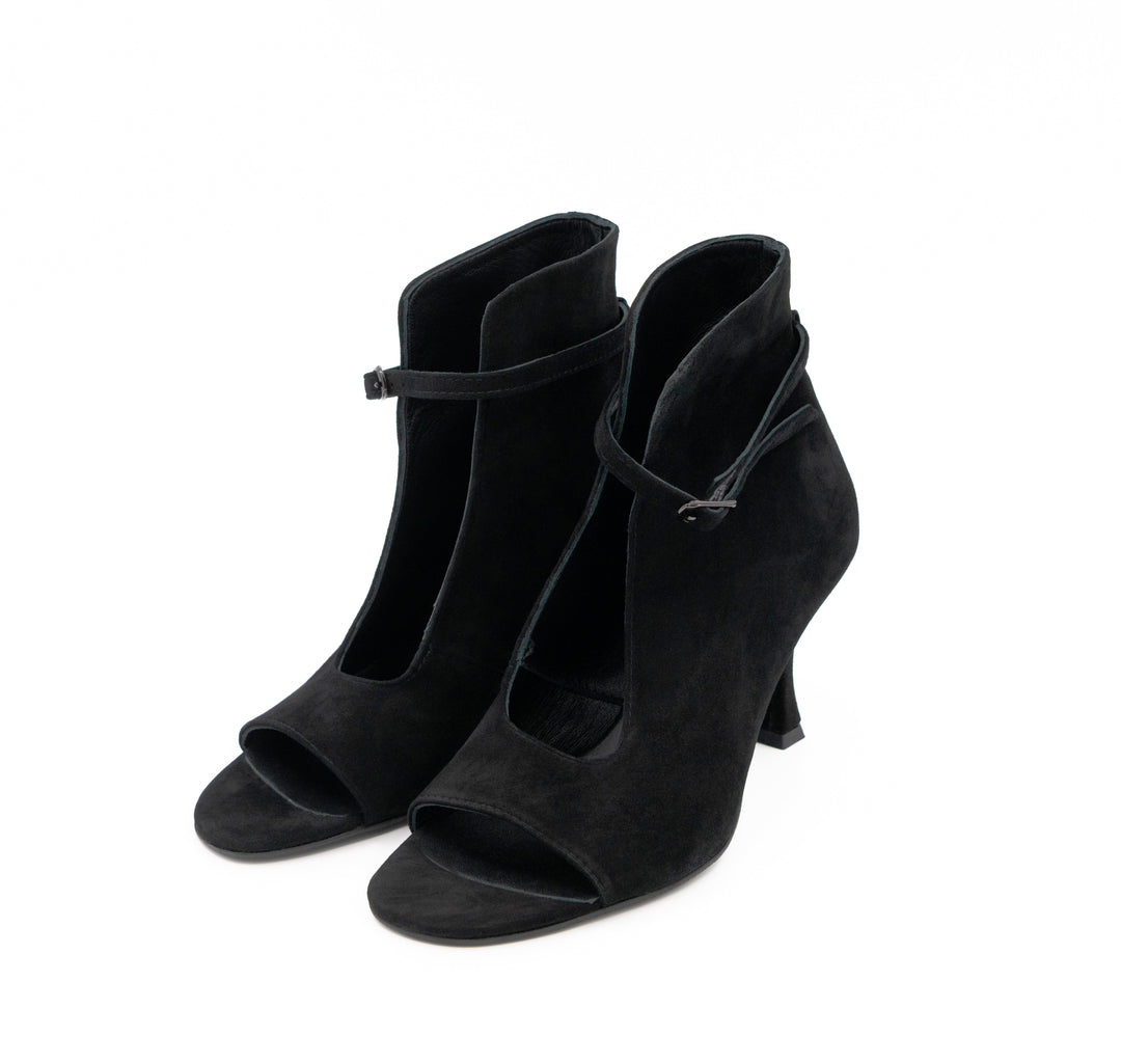 Meet Me Tonight black suede booties by Mihaela Glavan, three-quarter view showing the open toes, cut-outs and ankle straps.