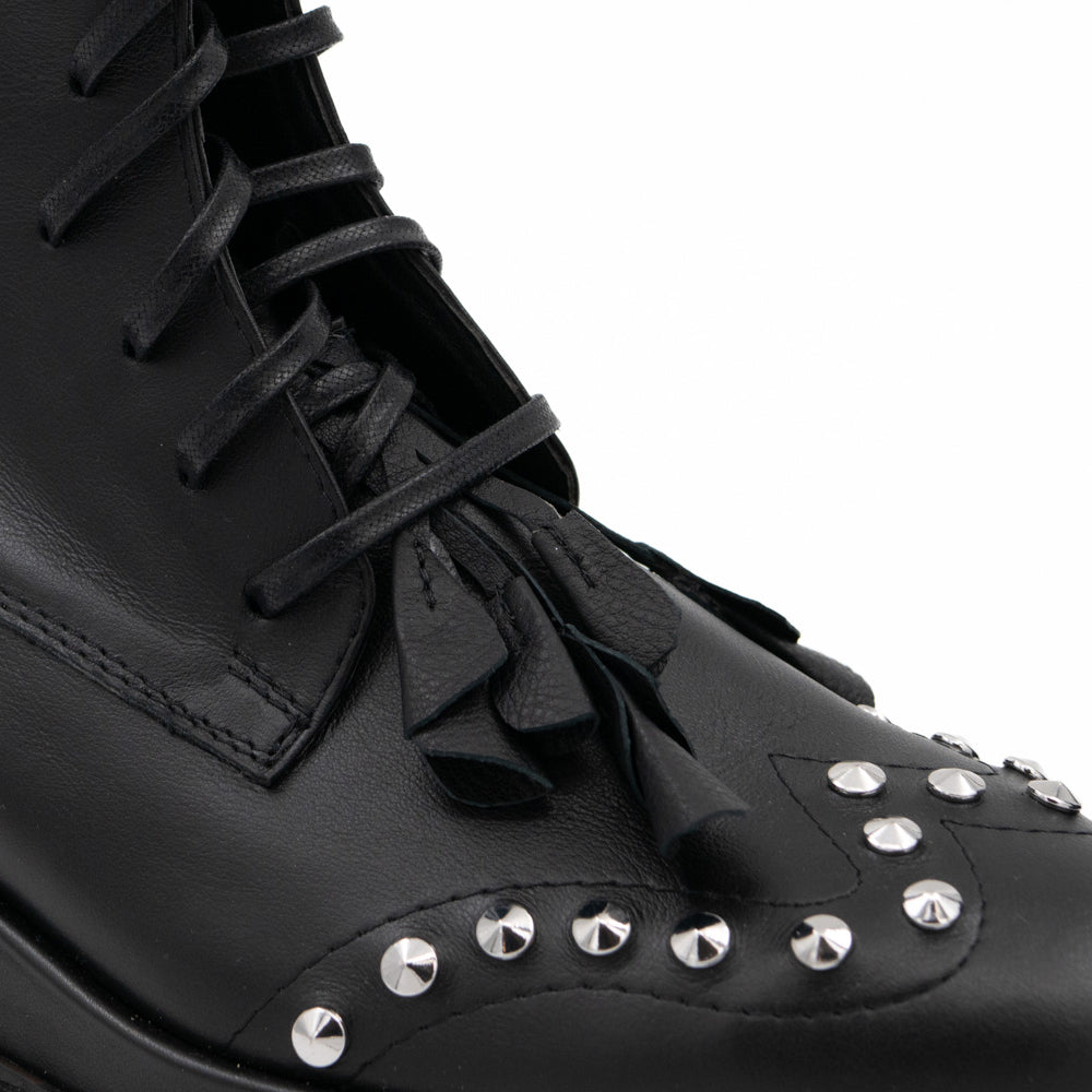 Punk Dreamer black leather lace-up booties by Mihaela Glavan, close-up of the black leather flowers, laces and metal studs.