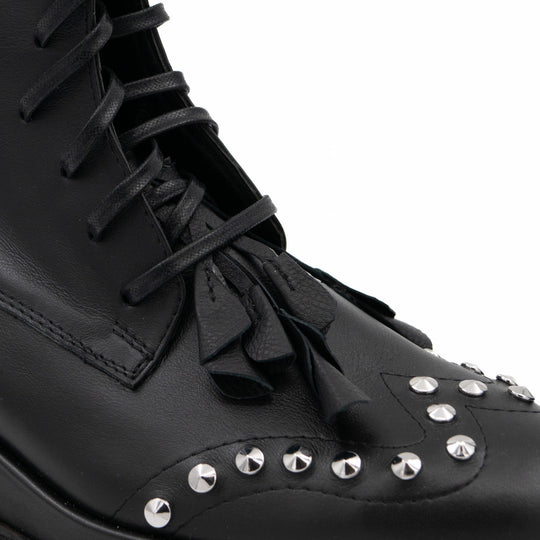 Punk Dreamer black leather lace-up booties by Mihaela Glavan, close-up of the black leather flowers, laces and metal studs.