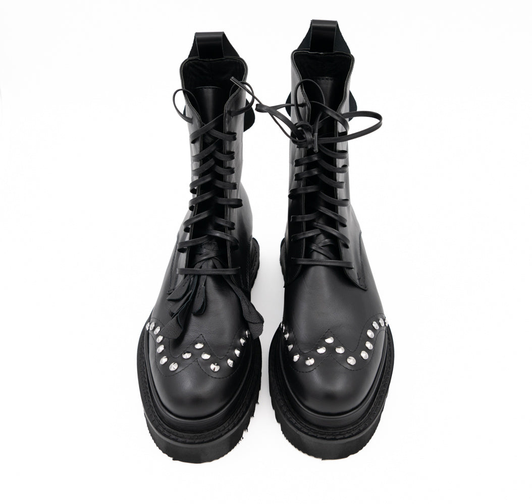 Punk Dreamer black leather lace-up booties by Mihaela Glavan, front view from above showing the floral details and stud placement.