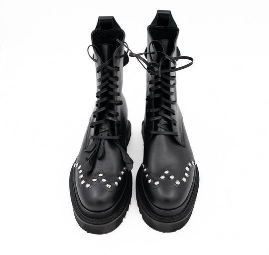 Punk Dreamer black leather lace-up booties by Mihaela Glavan, front view from above showing the floral details and stud placement.