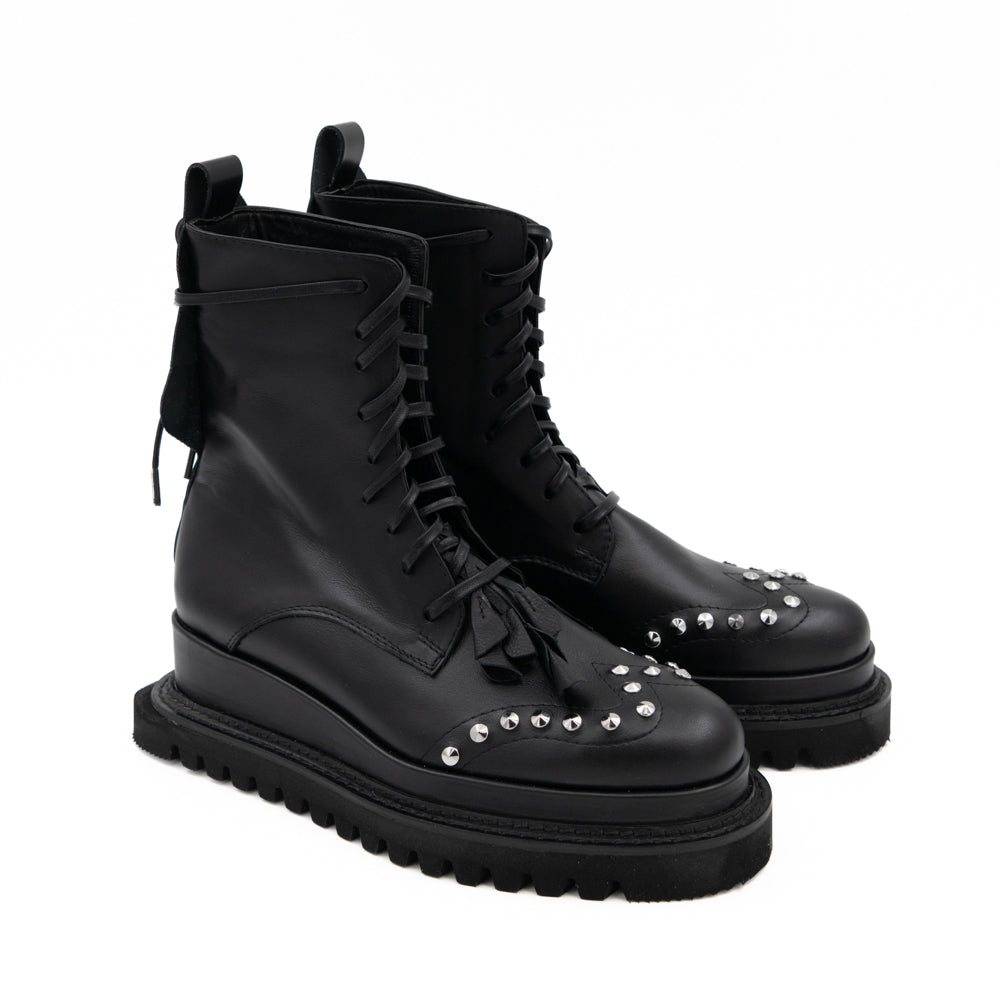 Punk Dreamer black leather lace-up booties by Mihaela Glavan, opposite three-quarter view of the lace-up upper and studded toes.