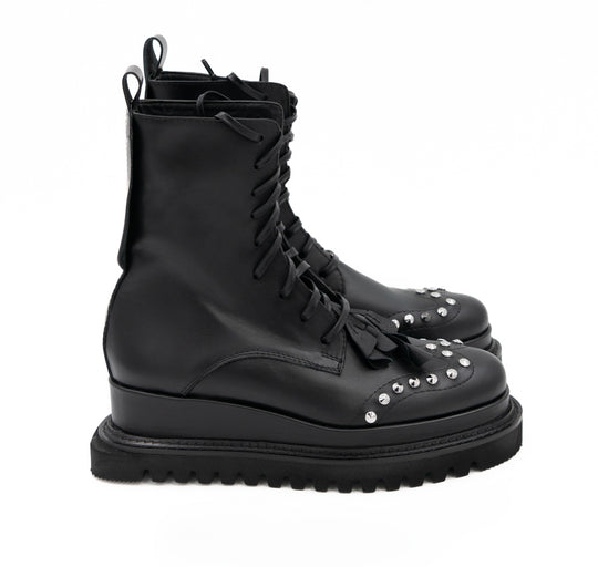 Punk Dreamer black leather lace-up booties by Mihaela Glavan, side view showing the leather upper and geometric sole.