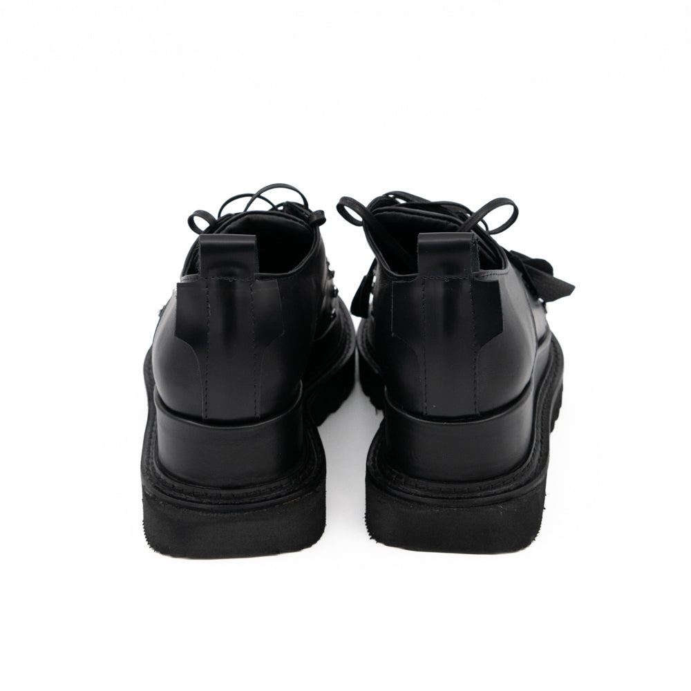 Punk Dreamer black leather lace-up shoes by Mihaela Glavan, back view of the leather heel panels and geometric soles.