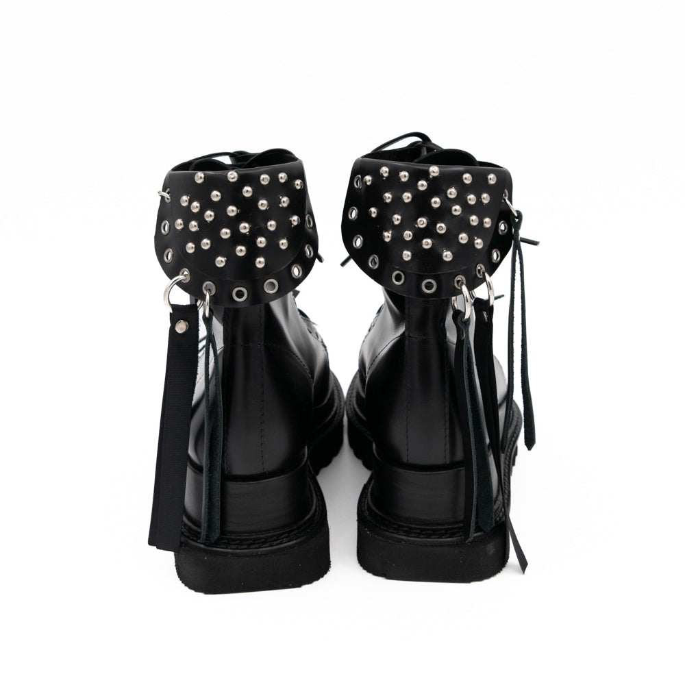 Punk Lover black leather lace-up booties by Mihaela Glavan, back view showing the studded panels and long leather strips.