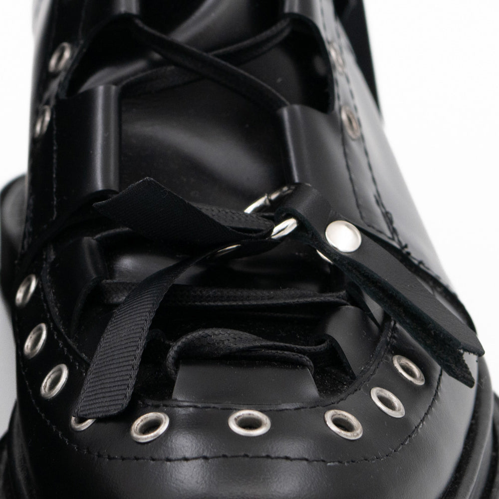 Punk Lover black leather lace-up booties by Mihaela Glavan, close-up of the eyelet details and black laces.