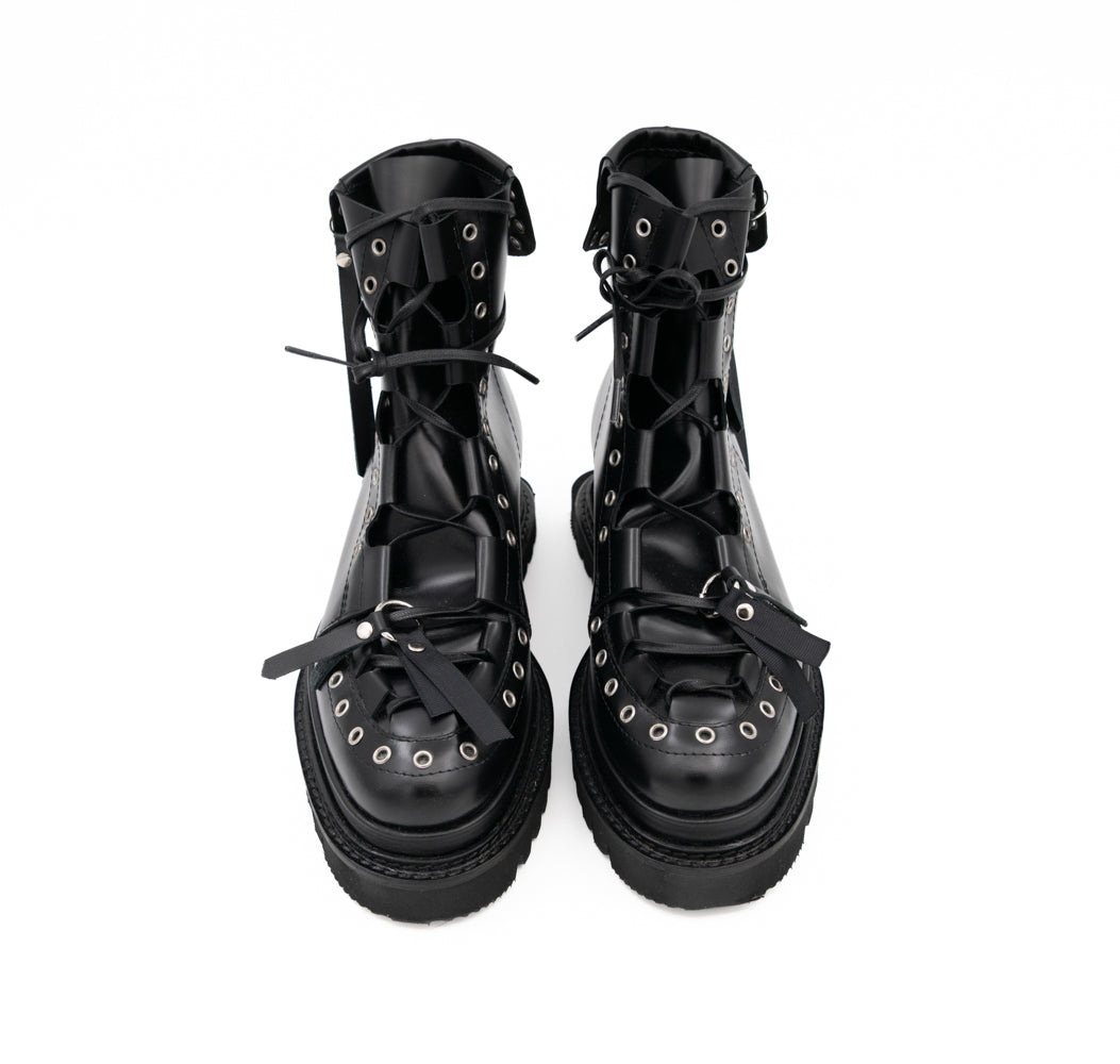 Punk Lover black leather lace-up booties by Mihaela Glavan, front view from above showing the metal details and black soles.