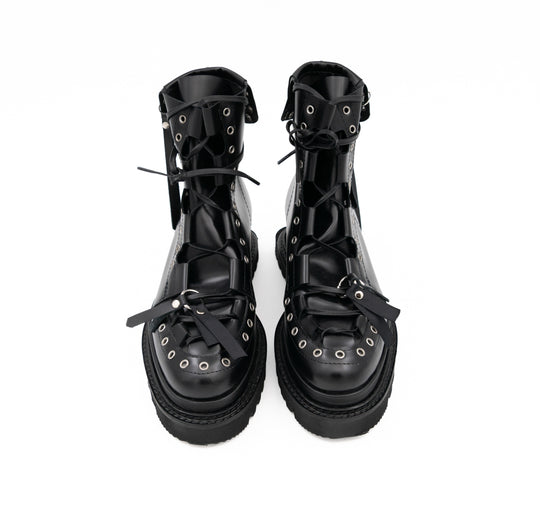 Punk Lover black leather lace-up booties by Mihaela Glavan, front view from above showing the metal details and black soles.