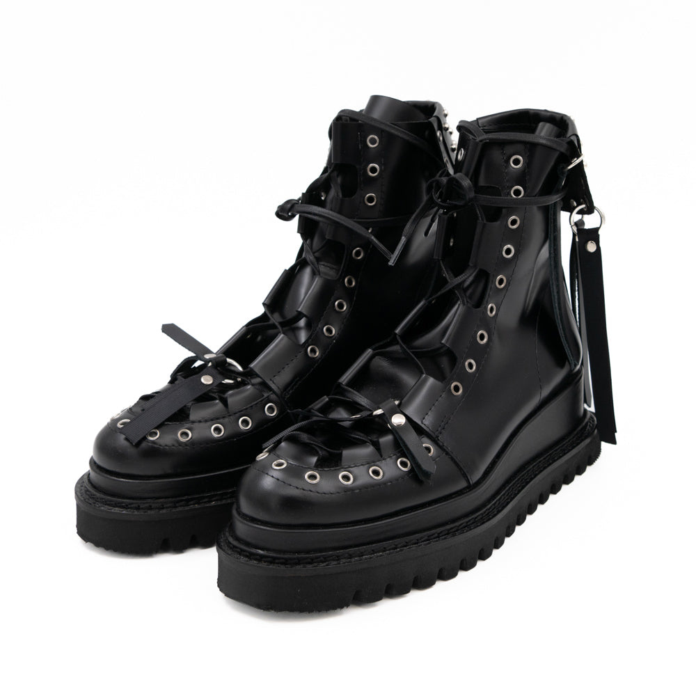Punk Lover black leather lace-up booties by Mihaela Glavan, opposite three-quarter view showing the metal accessories and lace-up front.