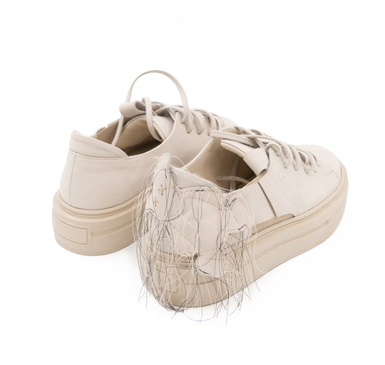 Teddy Soul light beige nubuck low-top sneakers by Mihaela Glavan, rear three-quarter view showing the quilted bear and hanging threads.